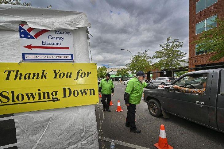 Federal Judge Blocks Trump Election Order Siding With Oregon Jeff Ogg Receives A Ballot On Monday May 16 2022 At A Drive Up Marion County Ballot Drop Site 